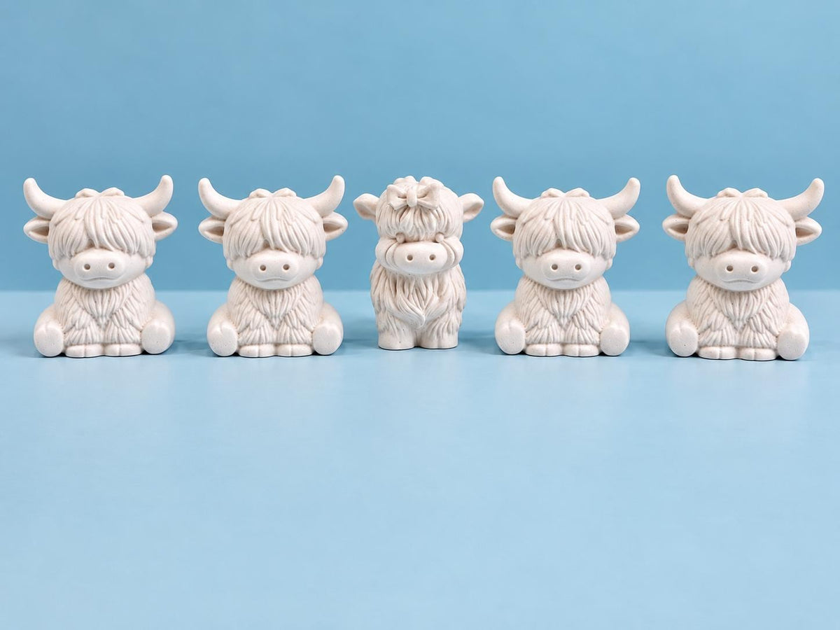 Five miniature plaster Highland Cow figures ready to paint