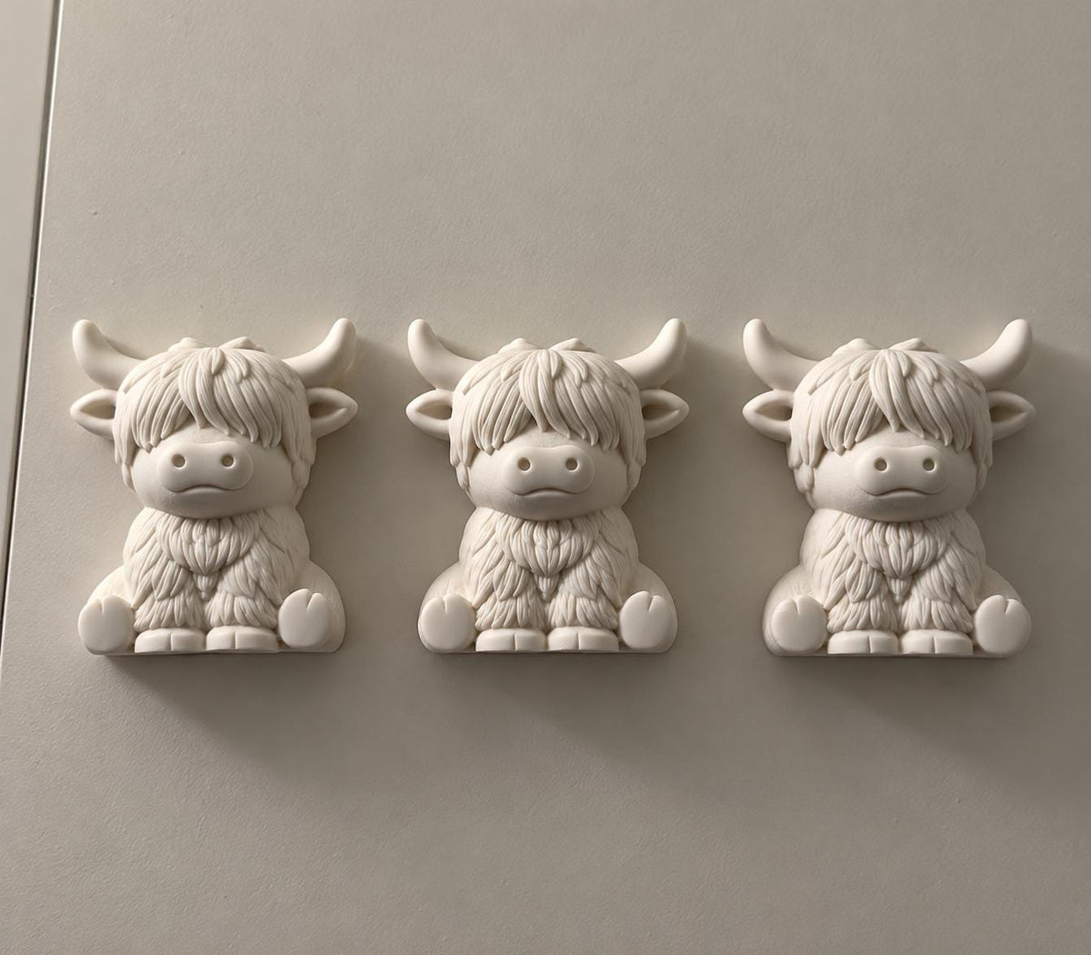 Painted miniature Highland Cows